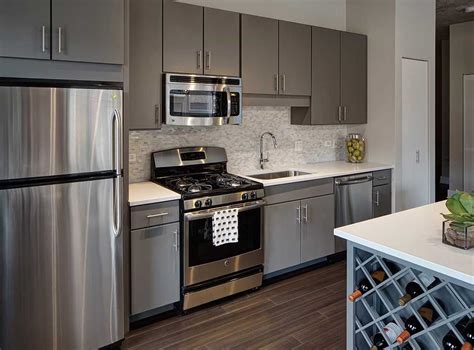 gray kitchen cabinets with stainless steel appliances pine walls|gray kitchen cabinets houston.